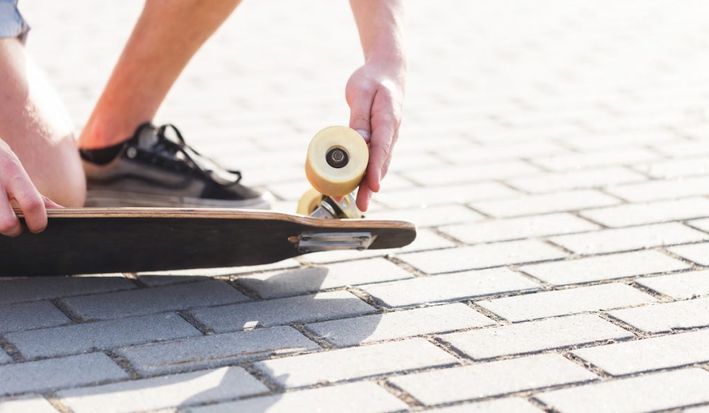 gentleman checking longboard