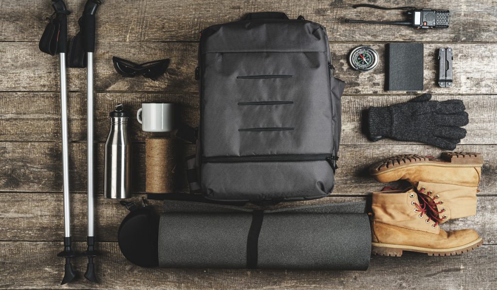 hiking equipment on wooden table