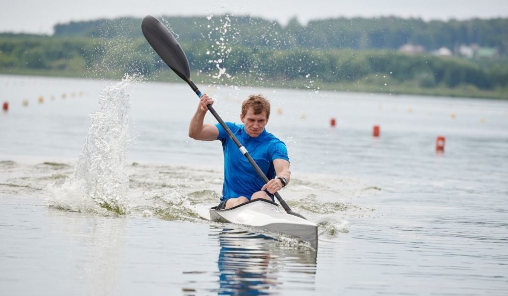 man kayaking in a race