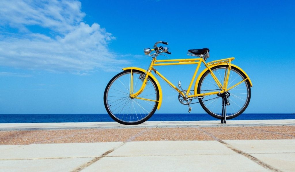 yellow bicycle parked at the street - ee220329