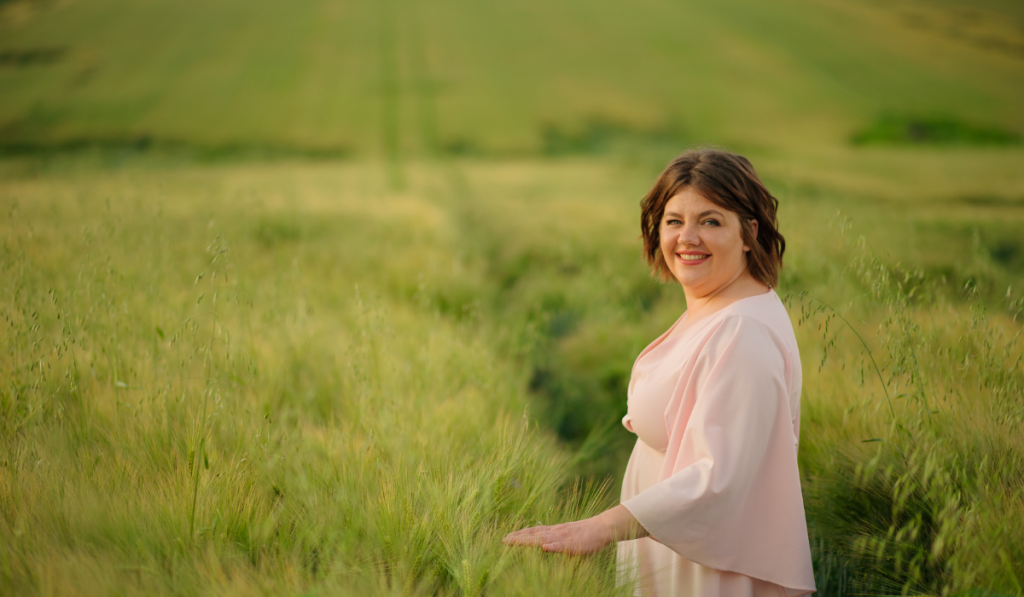 Portrait of a overweight woman in a pink dress.