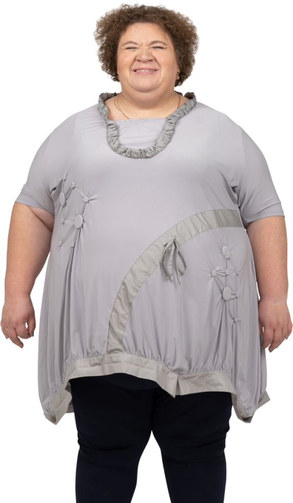 an overweight woman wearing a gray shirt and black pants