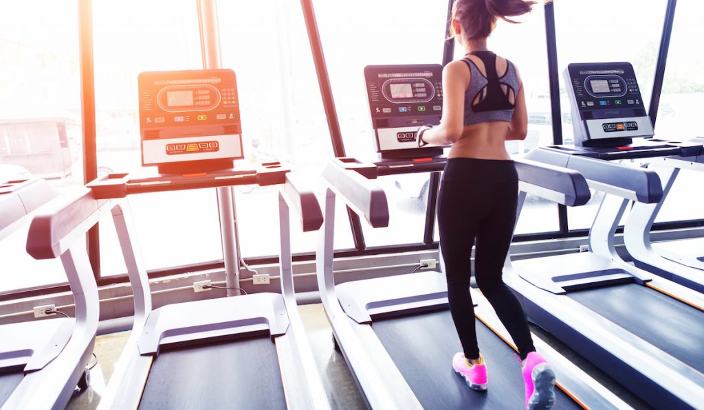 sexy woman running on treadmill 