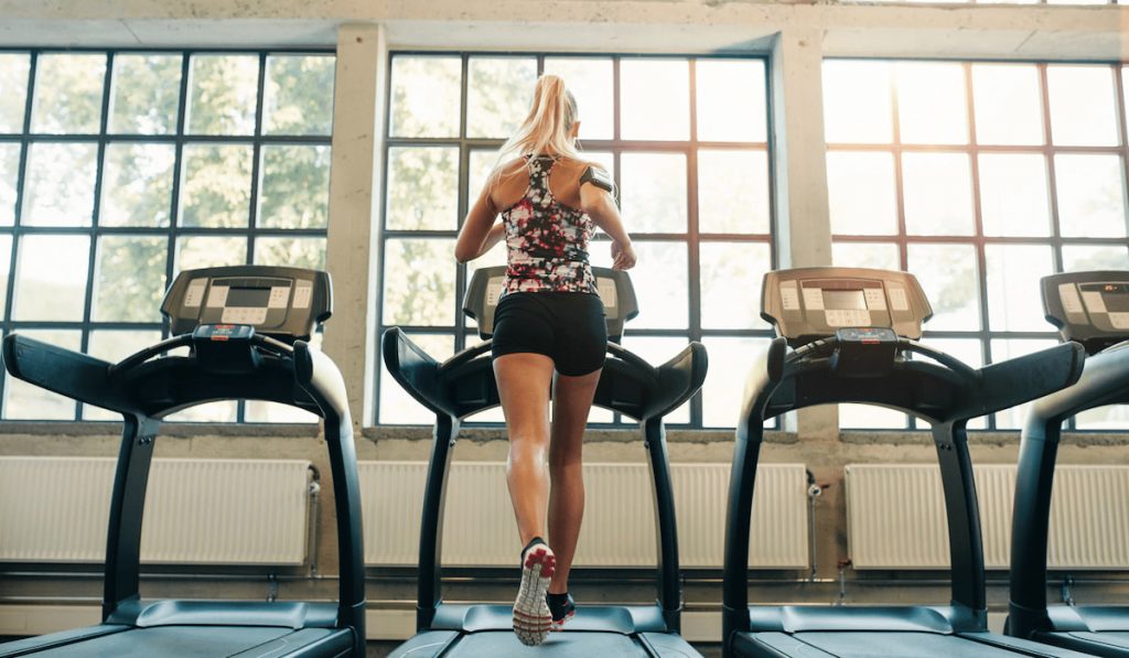 woman jogging on treadmill 