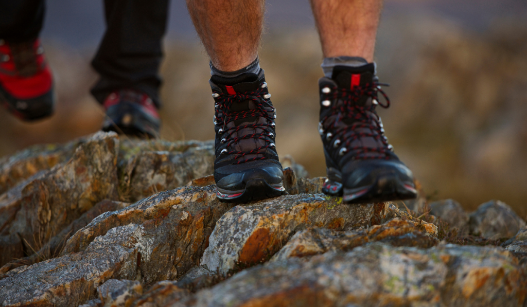 Close up of hiking boots on mountainside